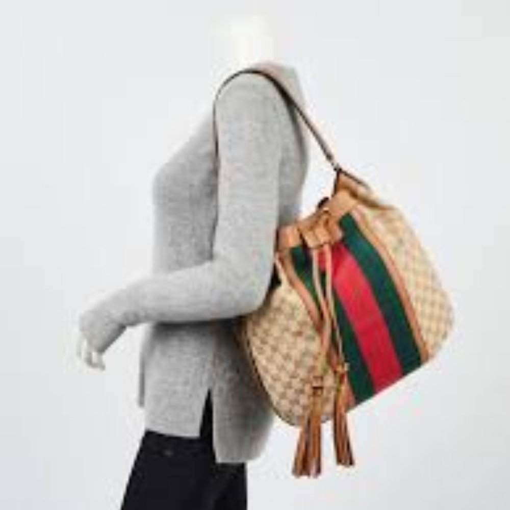 Authentic Gucci Rania Drawstring Shoulder Bag GG Canvas with Bamboo Tassels